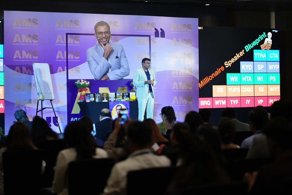 Amandeep speaking on stage during the workshop
