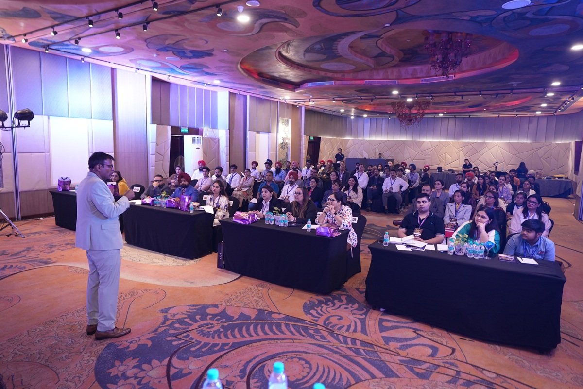 Wide view of the workshop audience and stage